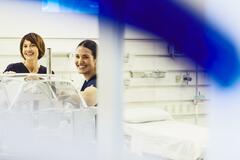 Two smiling nurses