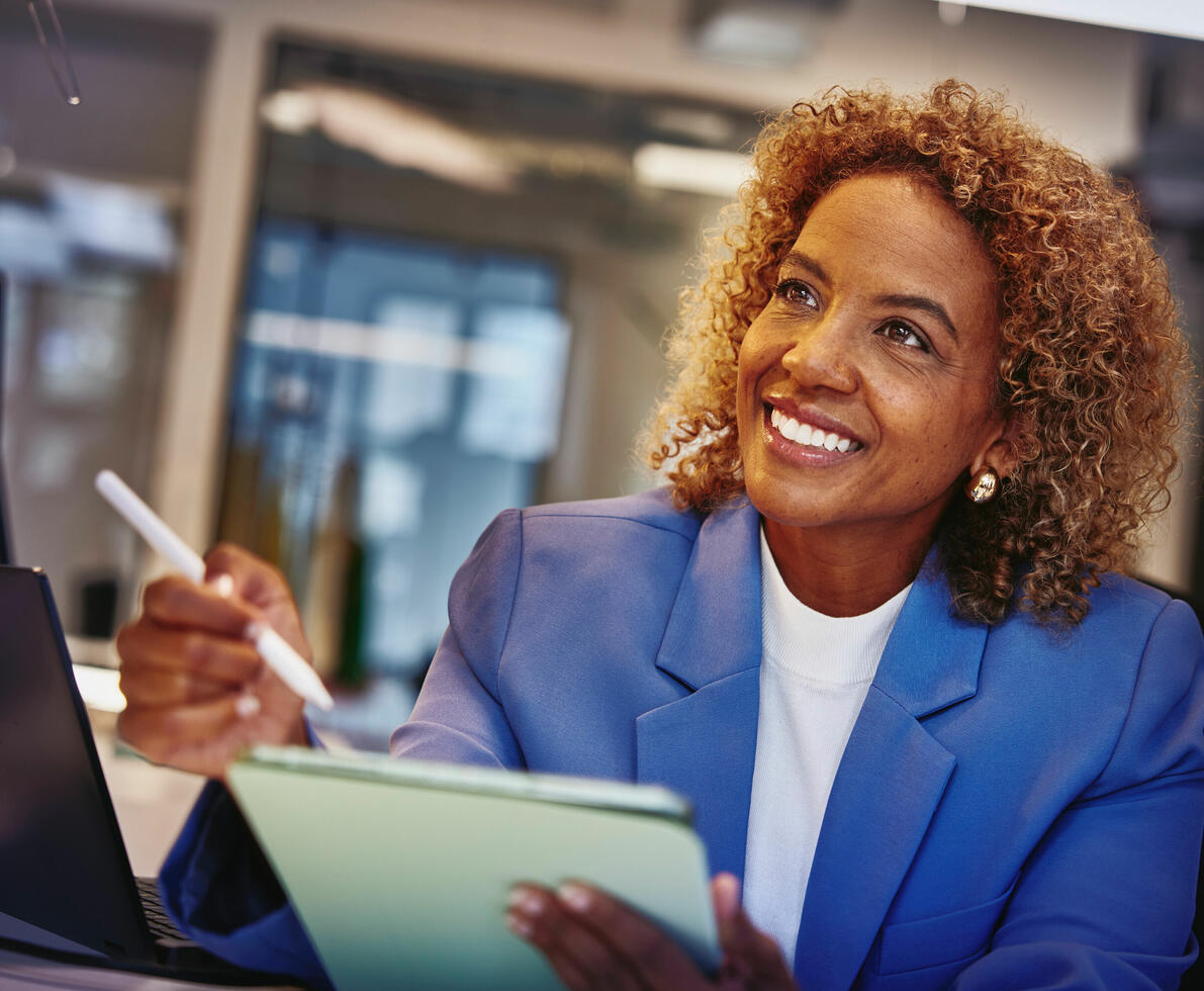A smiling woman with a notepad