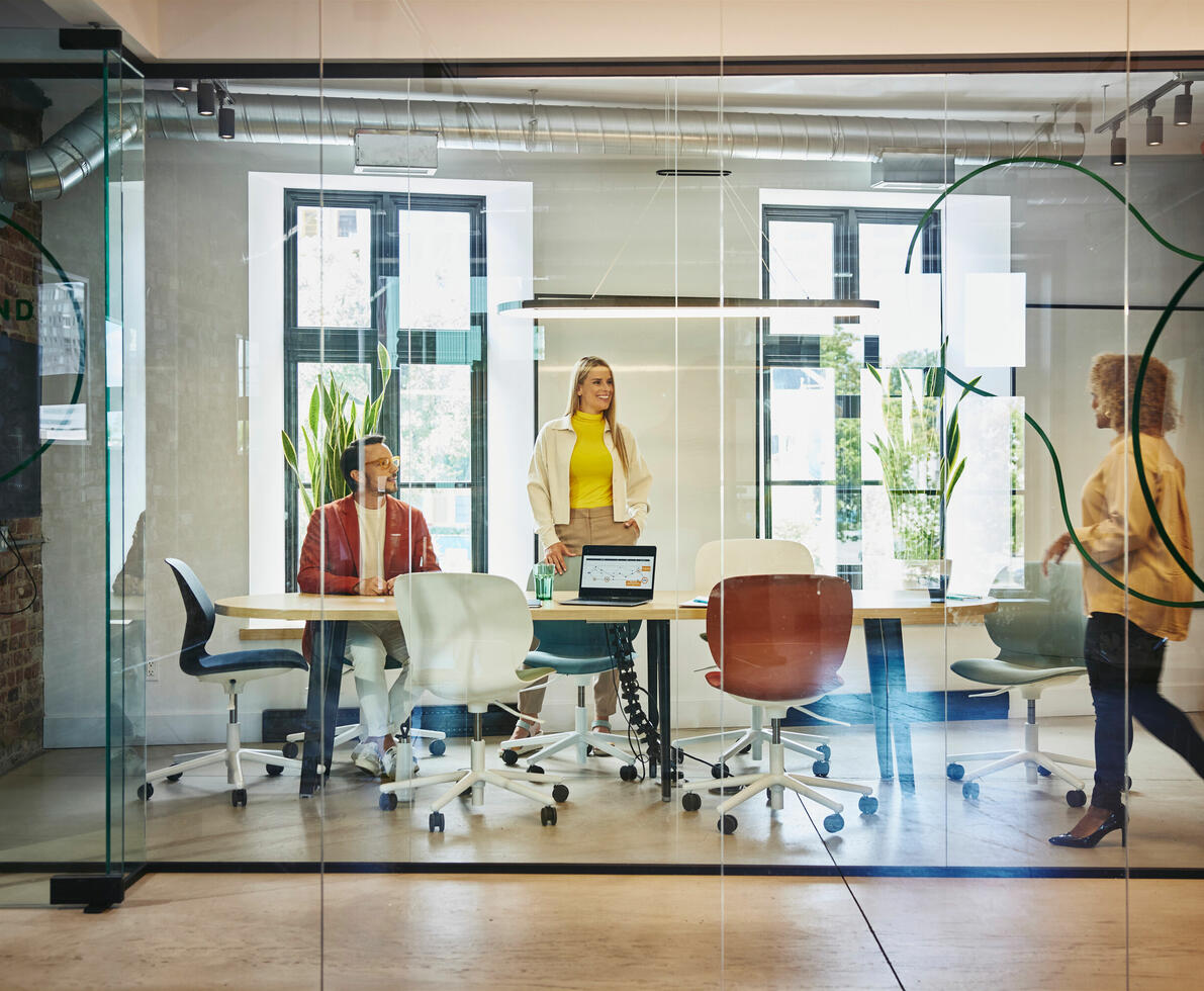 People walking into a meeting