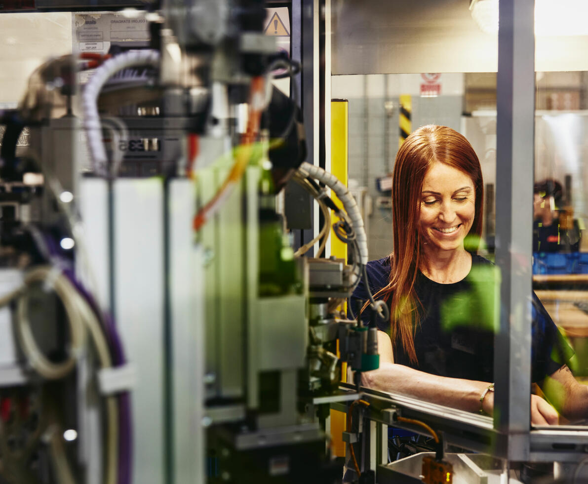 A woman working on a machine