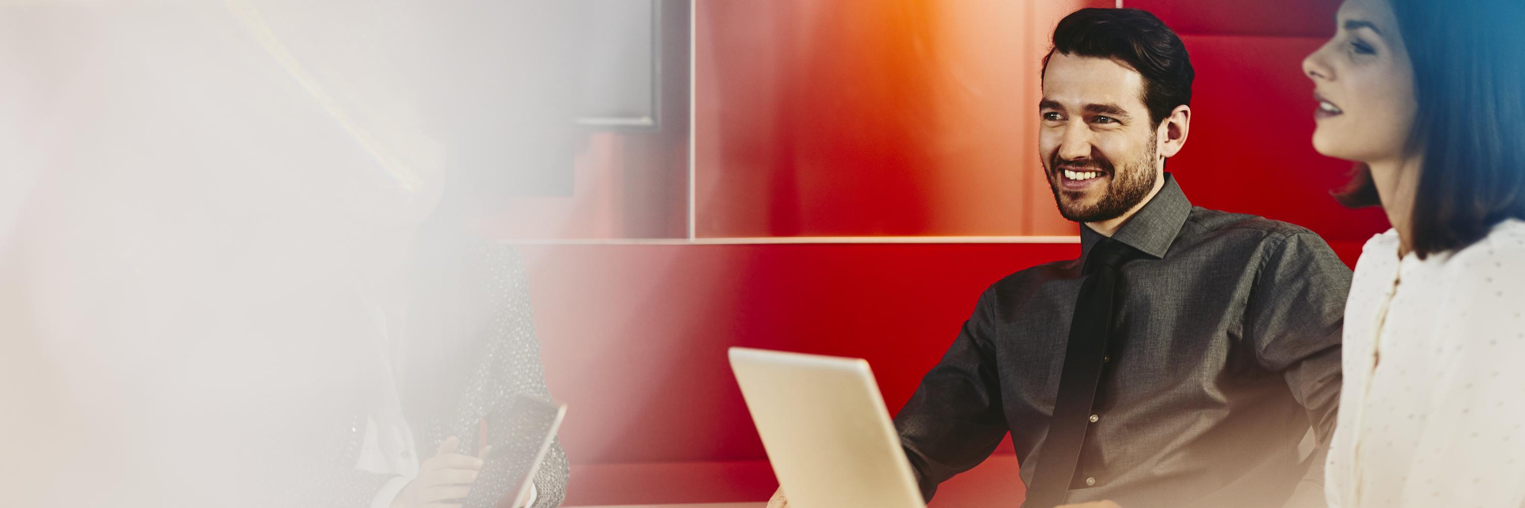 Business man and woman in an office having a meeting