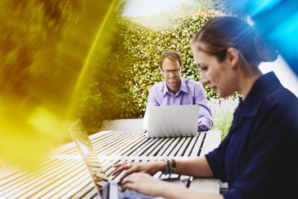 two people looking at computers